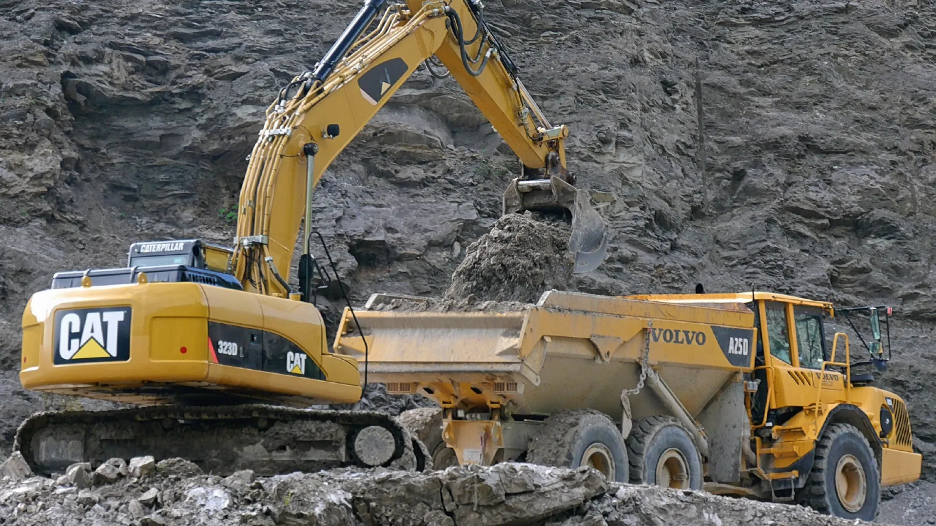 Excavator loading a dump truck